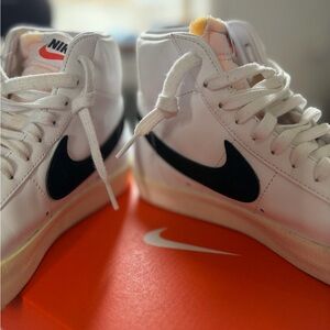 Nike White Leather Sneakers with Black Swoosh Accent